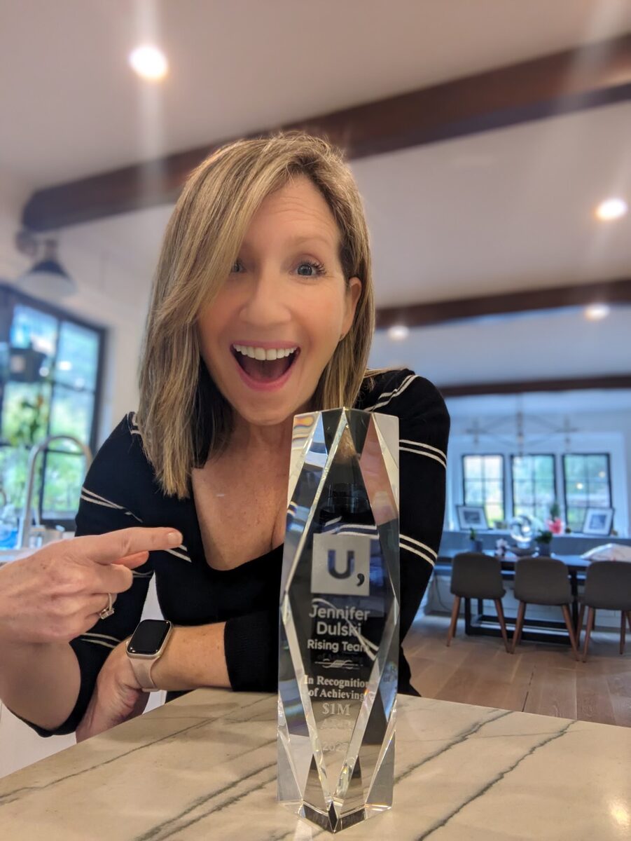 An Unstoppable Founder with their milestone trophy